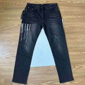 AMIRI Distressed Washed Embroidered Jeans